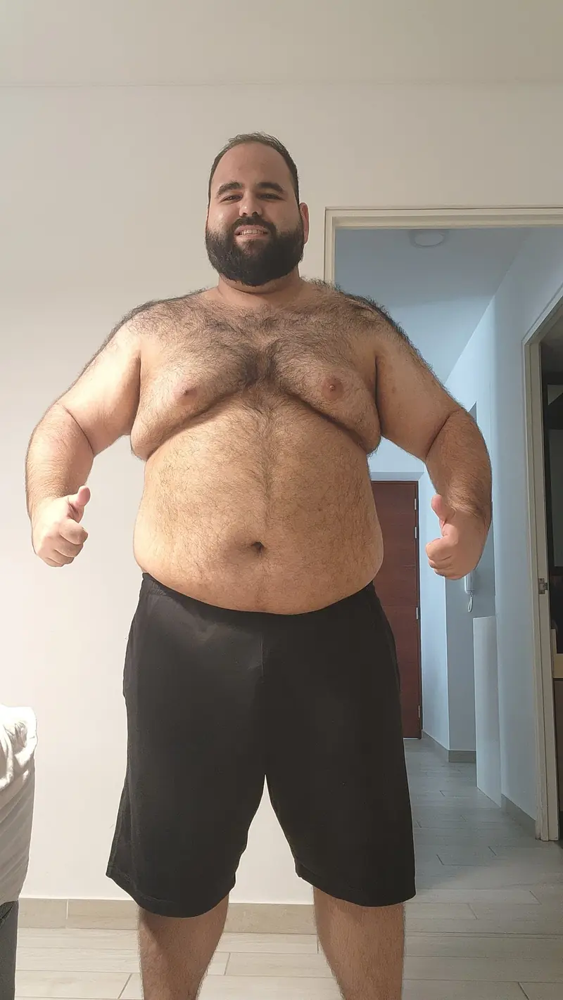 Renzo smiling while flexing at 295lbs (134kg), March 2024